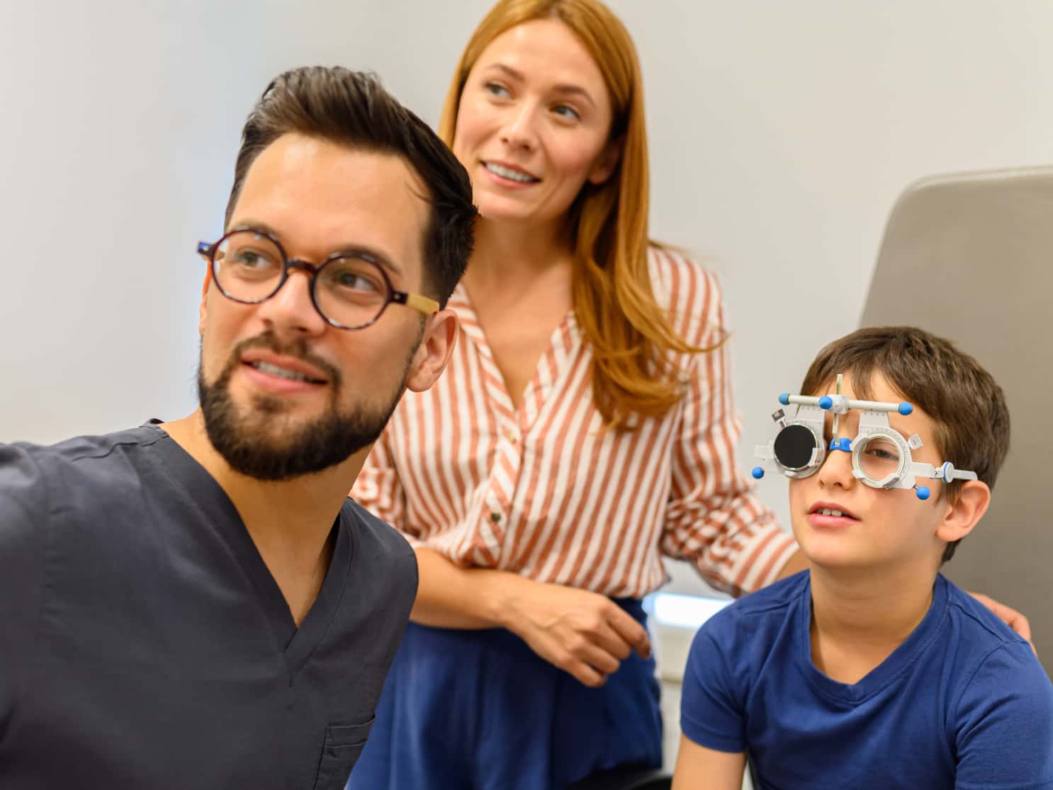 Ophthalmologist examining boy's vision